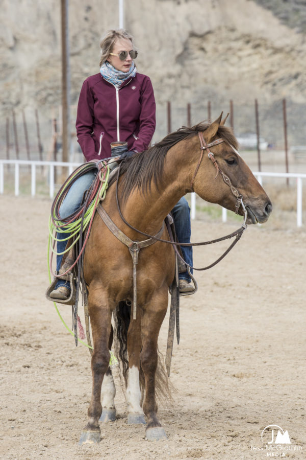 Cowgirl on a horse at a rodeo arena during an event in Idaho.