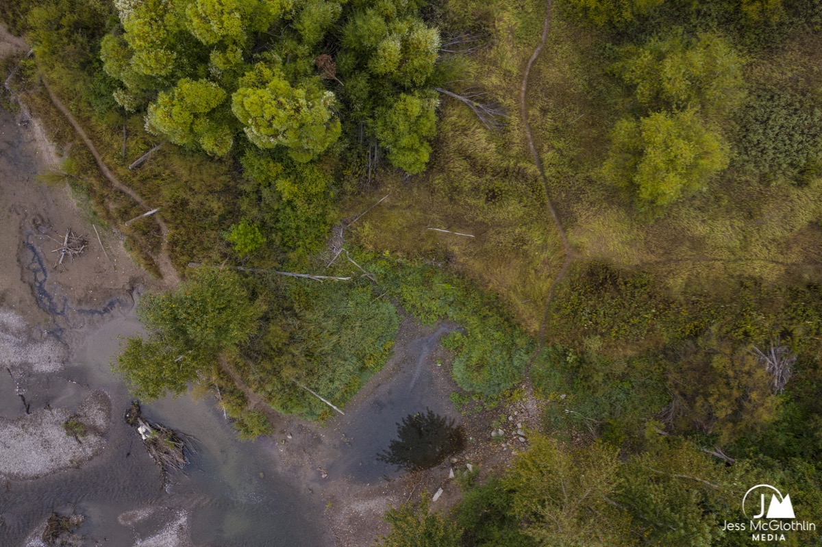 Aerial drone photograph of a boat ramp with drifts boats for fly fishing in Missoula, Montana, in the fall.