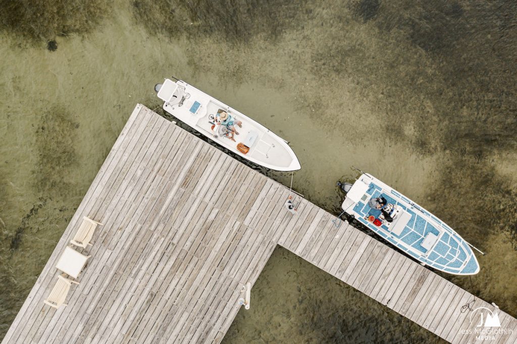 Two flats bots pangas at the dock at El Pescador Lodge in Belize ready to go fly fishing.