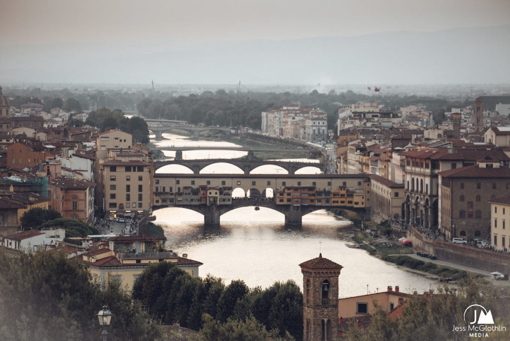 The Arno River in Florence, Italy, with bridges including the Ponte Vecchio. 